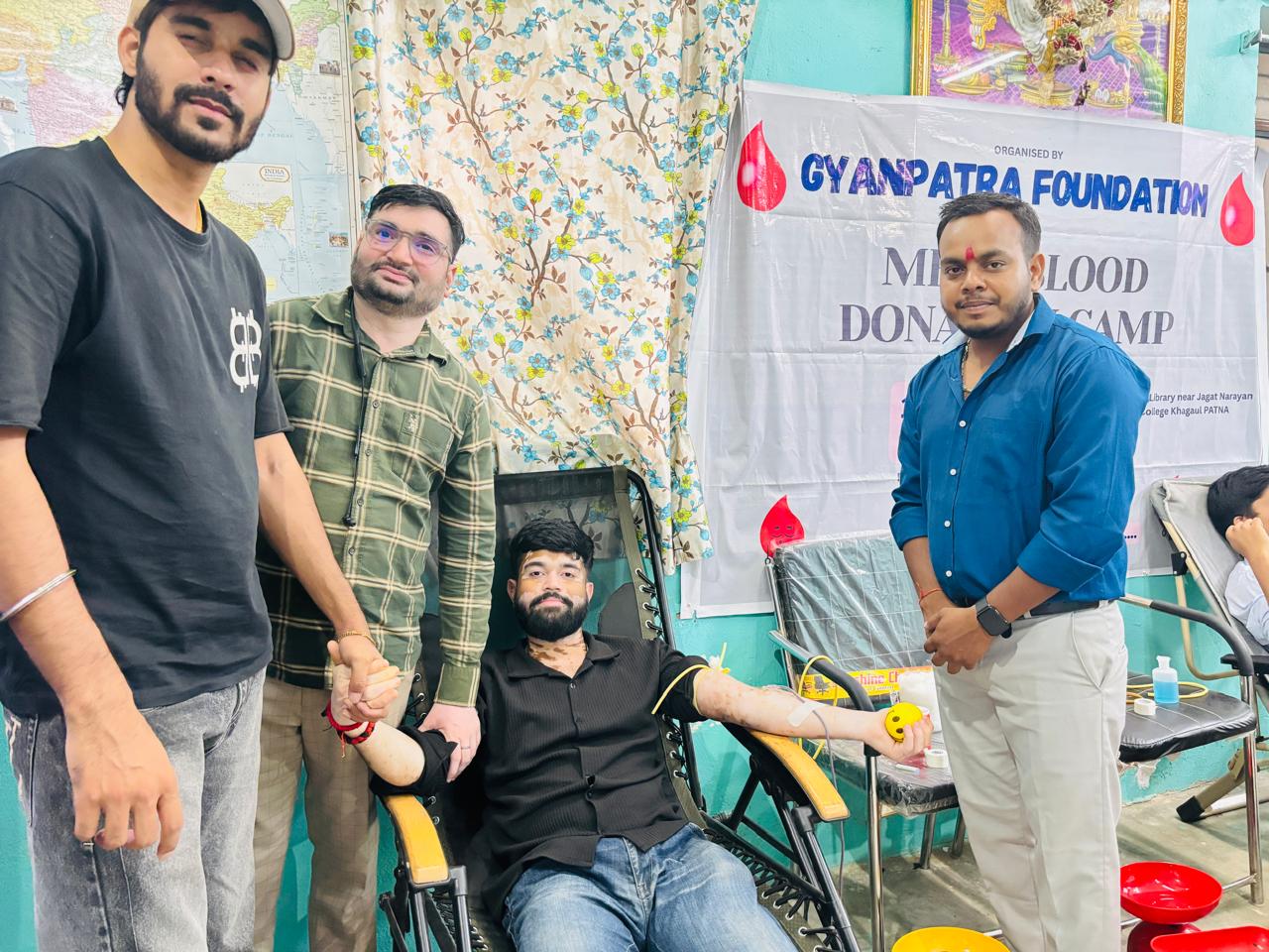 A donor with volunteers at the camp