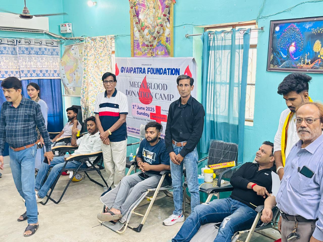 Donors and volunteers inside the camp hall