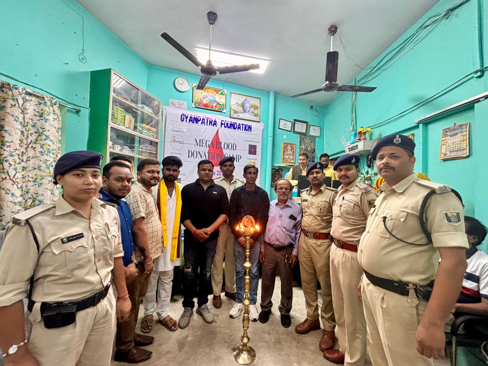 Guests, police officials and volunteers at the camp inauguration
