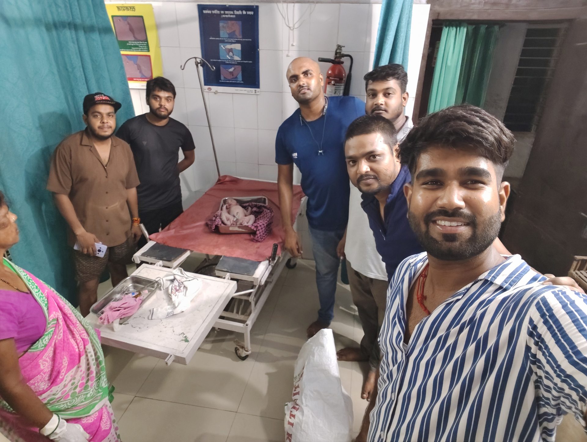 Volunteers with a patient at a hospital