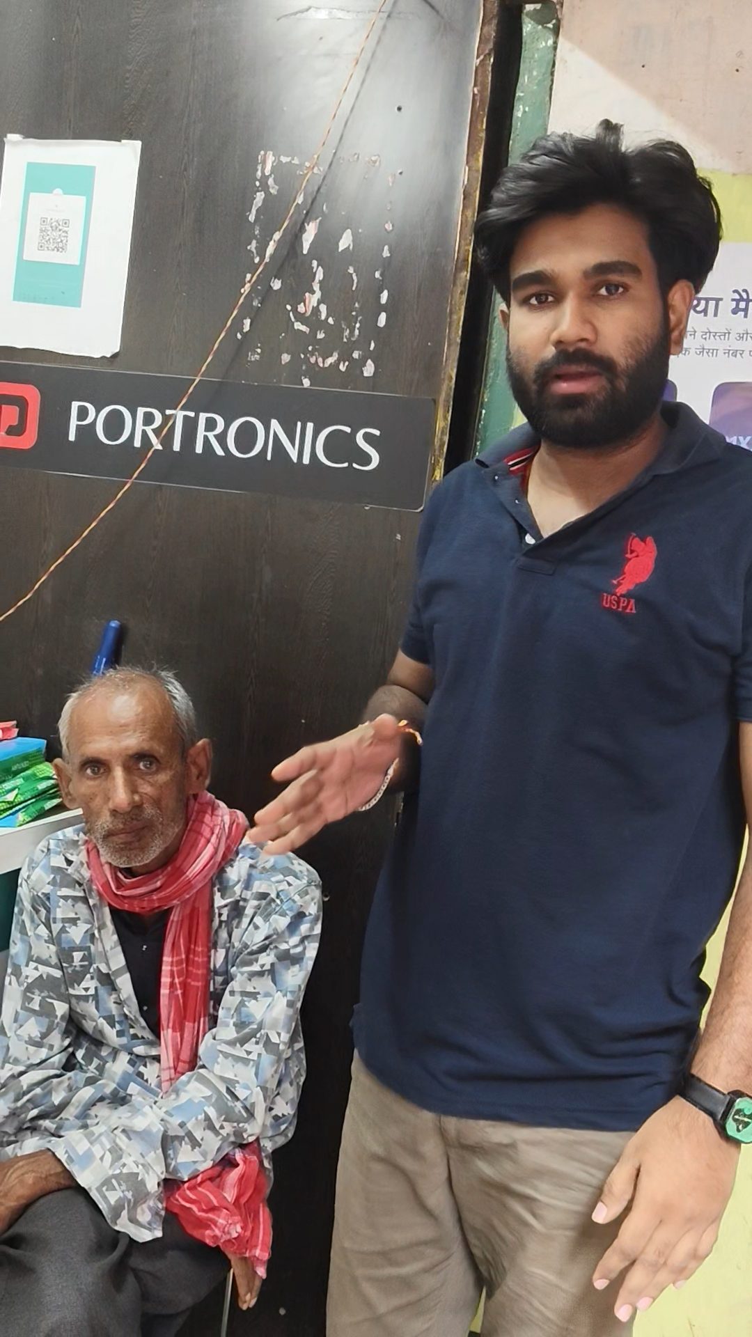 A volunteer with an elderly man he helped