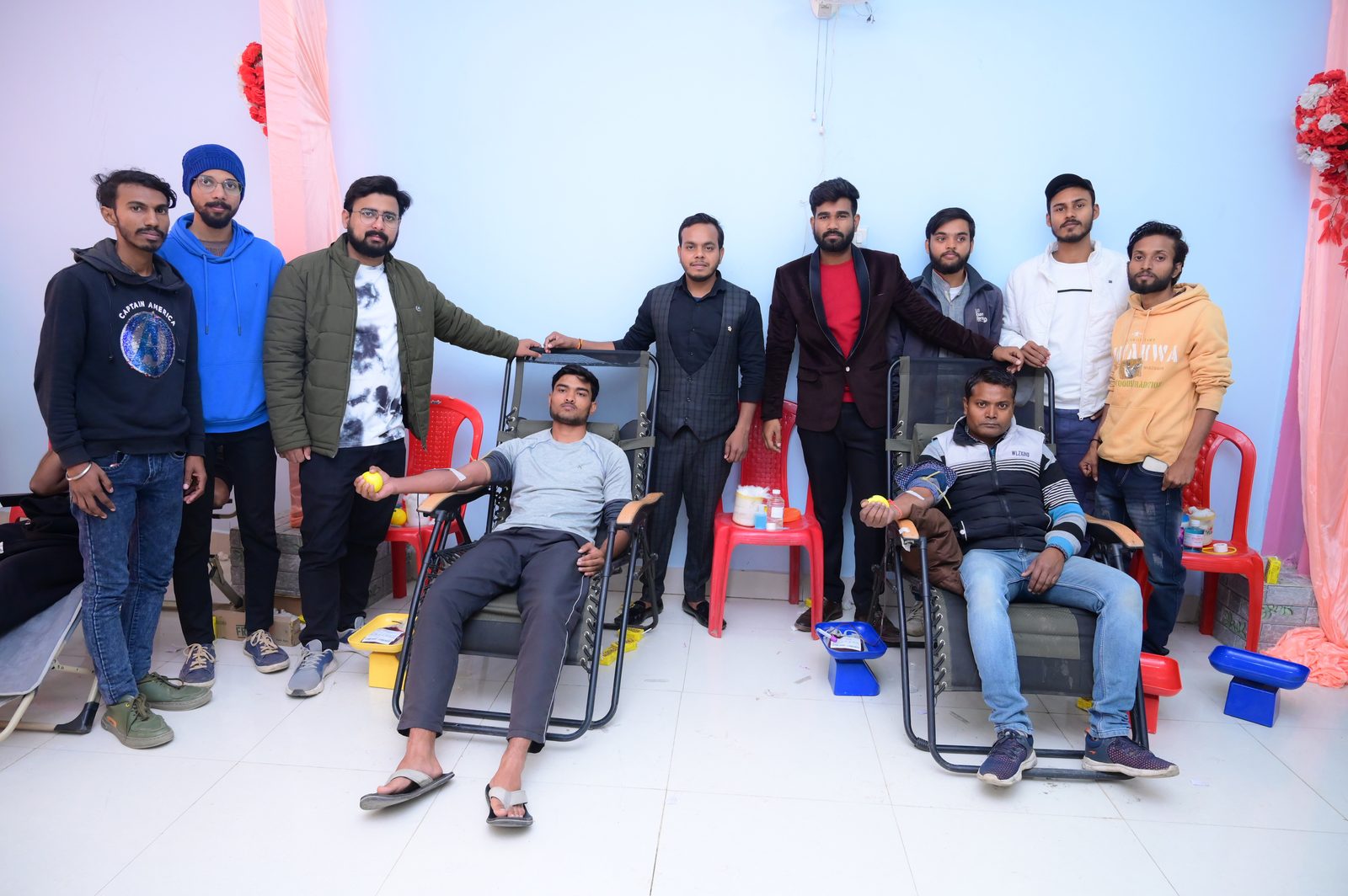 Volunteers and donors at a blood donation camp